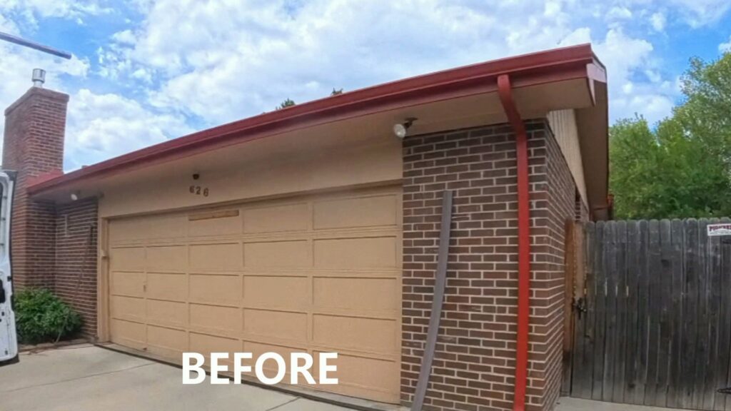 An old garage door before replacement by Advanced Door Works in Highlands Ranch, CO