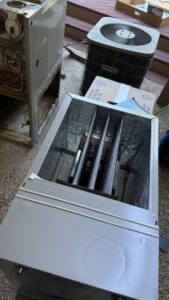 Old HVAC equipment being removed by Residential Express Heating & Air in Sterling, VA.