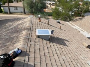 An old rooftop HVAC unit being removed during a replacement project by Klee's Climate Control in Mesa, AZ.