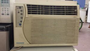 An old Fedders window air conditioning unit, representing cooling services from A-OK Heating & Cooling in Concord, GA.
