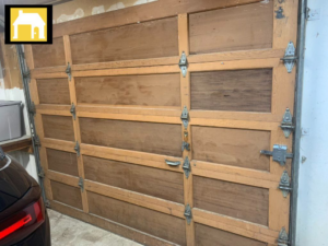 Interior view of an old wooden garage door with visible hardware, representing services from TH Locksmith And Garage Door Repair, Vancouver, WA.