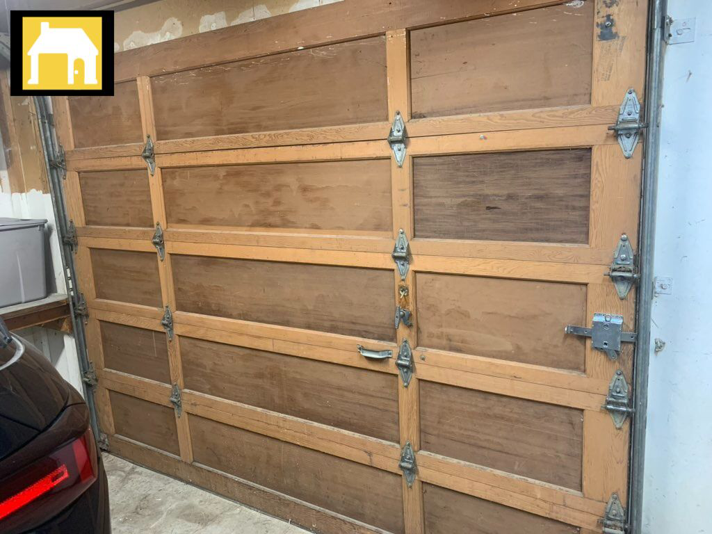 Interior view of an old wooden garage door with visible hardware, representing services from TH Locksmith And Garage Door Repair, Vancouver, WA.