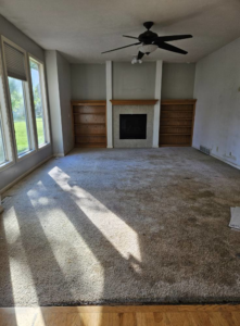 A room with old, worn carpet, ready for replacement by Flooring NuVo in Gretna, NE.