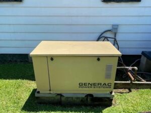 An older Generac Power Systems generator professionally installed next to a house by Craig's Electrical and Generator Service in Kenner, LA.