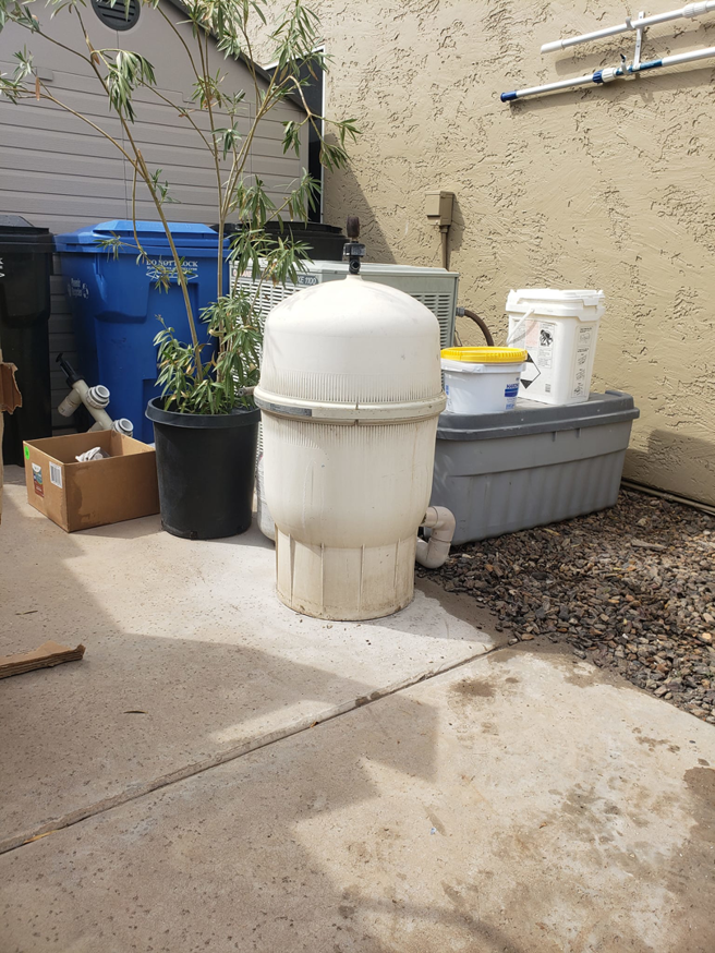 An older pool filter system requiring maintenance from Cruz pool service and repair in Lees Summit, MO