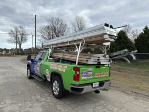 On Track Garage Doors service truck loaded with new garage door panels in Charleston, SC.