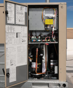 An open commercial HVAC unit revealing internal components during an inspection or repair by Number 1 Plumber in Washington, DC.