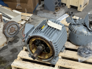 An open electric motor showing its stator windings, indicating repair or inspection by Richards Electric Motor Co. in Quincy, IL