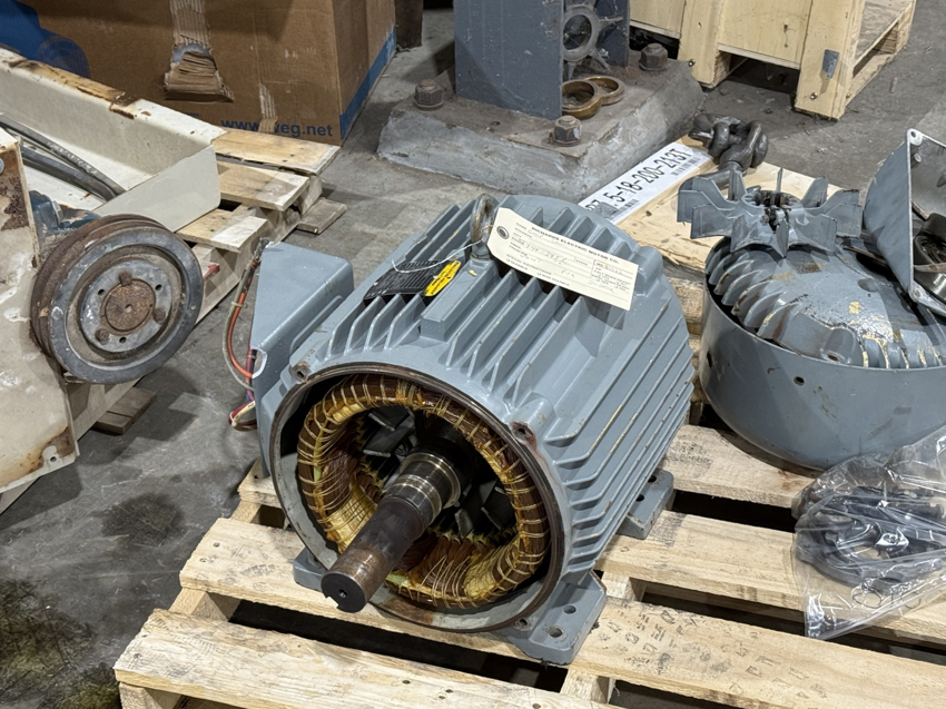 An open electric motor showing its stator windings, indicating repair or inspection by Richards Electric Motor Co. in Quincy, IL