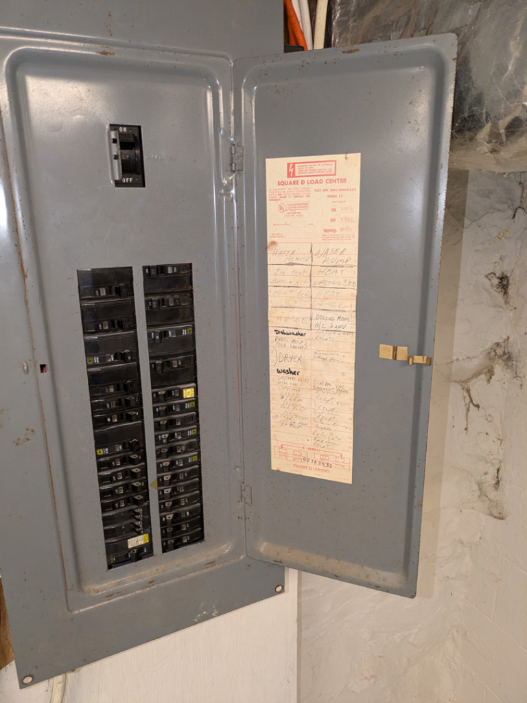An open electrical breaker box with circuit labels, showing typical work for MLP Services in Sharpsburg, MD