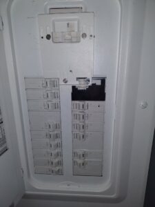 An open electrical breaker panel showing multiple circuit breakers, installed by 3C Electric Systems in Hartford, CT.