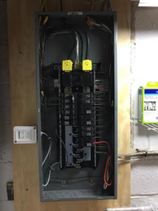 An open electrical breaker panel showing intricate wiring, expertly handled by ELSI Electric LLC in Rockville, MD.