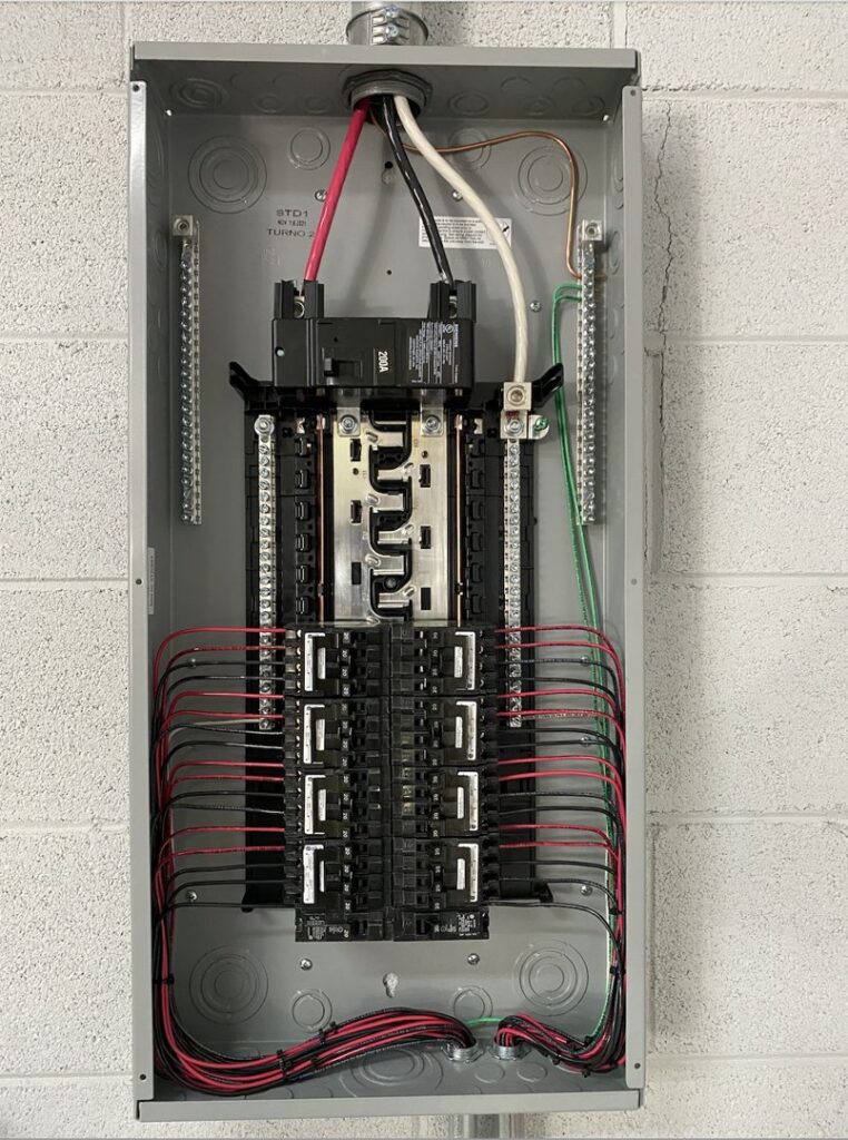 An open electrical breaker panel showing neatly organized wiring and circuits, installed by Muse Electricians in Los Angeles, CA.