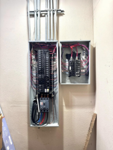 Open electrical breaker panels showcasing professional wiring and installation by OCD Electric in Spokane, WA.