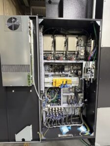 An open electrical cabinet showing complex wiring and components, installed by Pioneer Electric LLC in West Valley City, UT.