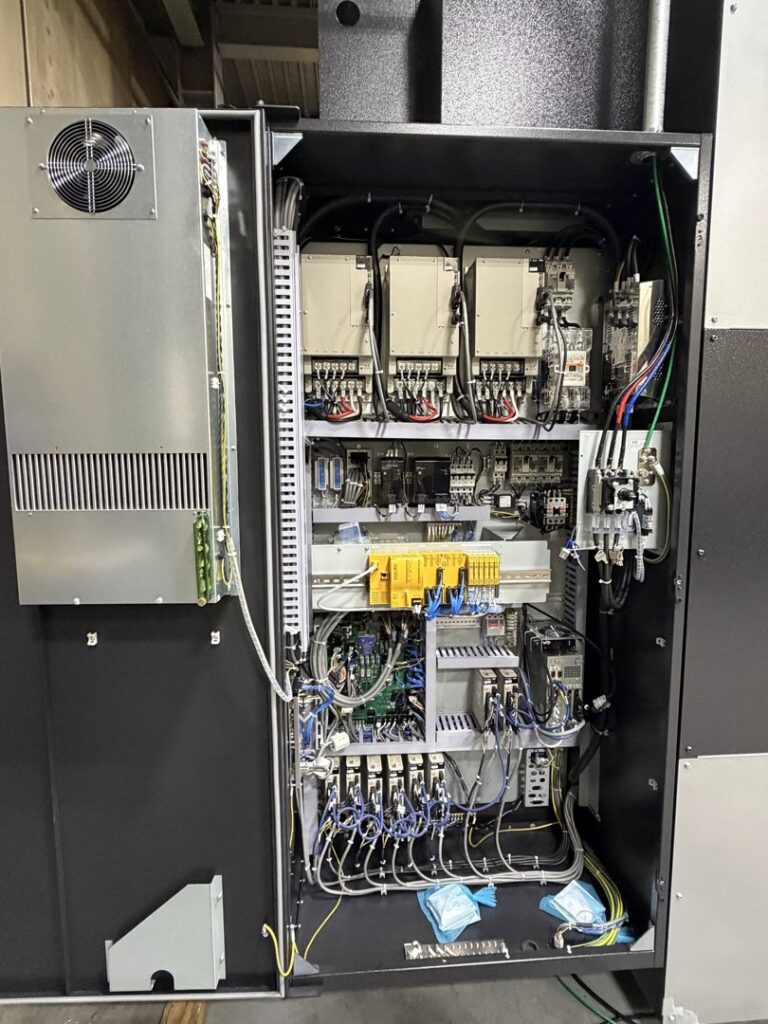 An open electrical cabinet showing complex wiring and components, installed by Pioneer Electric LLC in West Valley City, UT.