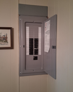 An open electrical panel or breaker box, a common service provided by Mr. Electric of Lakeland, FL.
