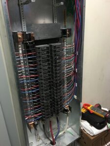 An open electrical panel displaying circuit breakers and wiring, a job performed by Esmeralized Electric in San Jose, CA.