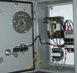 An open electrical panel featuring a large disconnect switch and internal wiring, demonstrating the work of Basic Supply in Lafayette, LA.