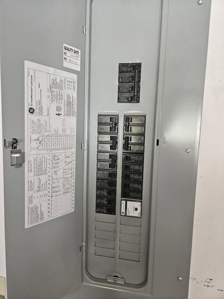 An open electrical panel with circuit breakers and wiring, inspected by Crawford Electric Services, LLC in Kings Mountain, NC.
