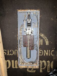 An open electrical panel with neatly organized wiring, installed by Revamp Athens Electrical Company in Athens, GA.