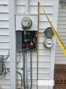 Open electrical panel and meter on a house exterior before service by HLR Electric Company, LLC in Durham, NC.