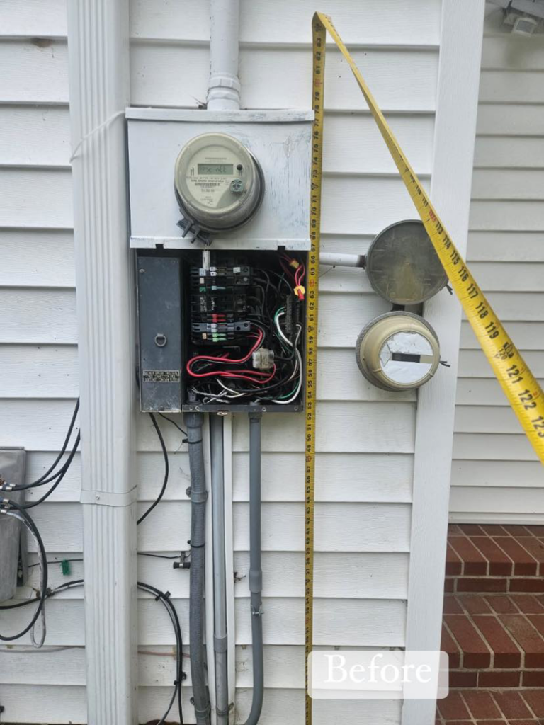 Open electrical panel and meter on a house exterior before service by HLR Electric Company, LLC in Durham, NC.