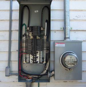 An open electrical panel and utility meter on a house exterior, showing expert electrical service from MSMB Maintenance in Greenville, SC.