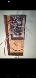 An open electrical panel showing complex wiring, handled by ANT POWER LLC in Tacoma, WA.