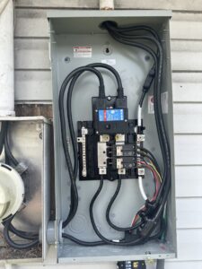 An open electrical panel with complex wiring, showcasing work by Bee Electrical Contracting in Port Saint Lucie, FL.