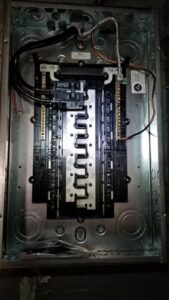 An open electrical panel with visible wiring, showcasing work by Detroit Speedy Electrician in Detroit, MI.