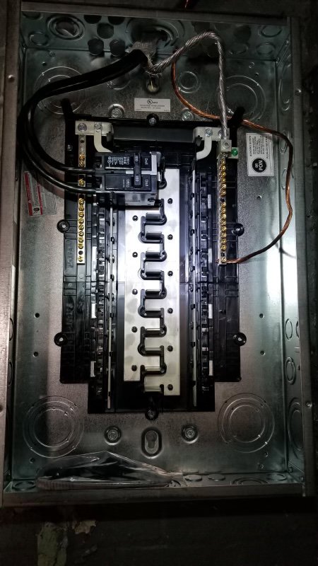 An open electrical panel with visible wiring, showcasing work by Detroit Speedy Electrician in Detroit, MI.