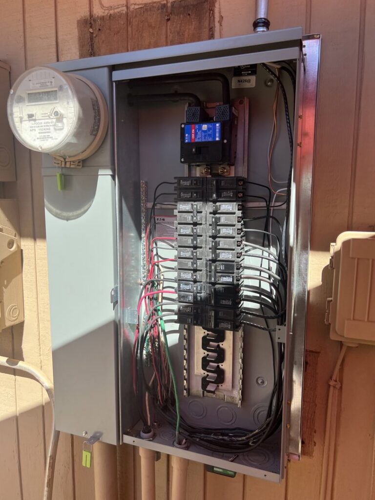 An open electrical panel displaying wiring and circuit breakers, showcasing electrical work by G5 Electric, LLC in Evansville, IN.