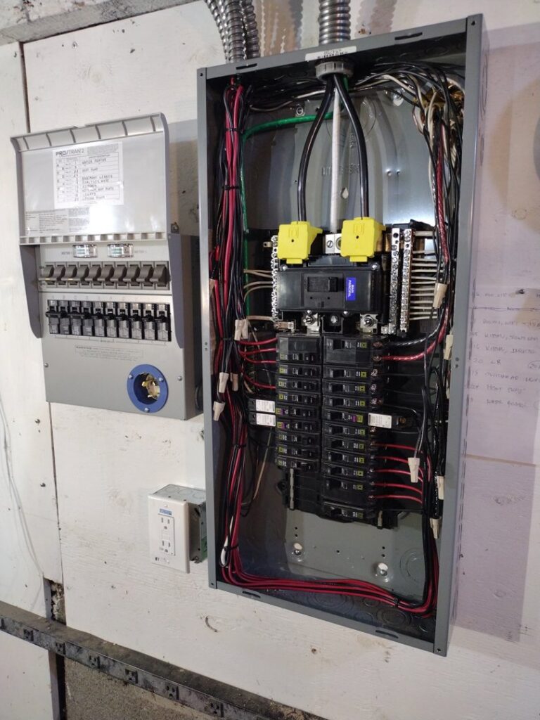 Two open electrical panels showing internal wiring and breakers, installed by GMD Electric in Springfield, OR.