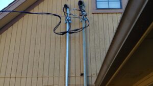 An open electrical service panel installation on a residential building by A Renewable Electric LLC in Houston, TX.