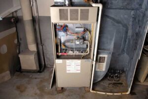 An open furnace unit revealing its internal components, indicating maintenance or repair by NorthStar Services in South Haven, MN