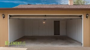 Interior view of an open garage door, showcasing the space and overhead mechanism by Element Garage Door Repair Of Portland, OR