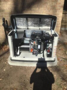 An open Generac generator showing internal components, indicating installation or service by Mr. Electric of Rogers in Rogers, AR.