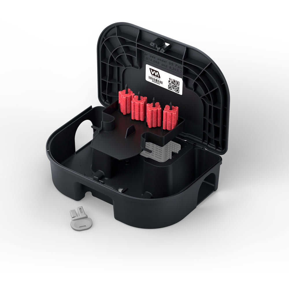 An open rodent bait station with red bait blocks inside, used by VM Products for pest control in Arlington, TX