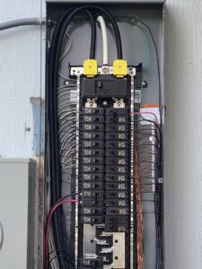 An organized electrical breaker panel with neatly arranged wiring, serviced by All Electric llc in Denver, CO