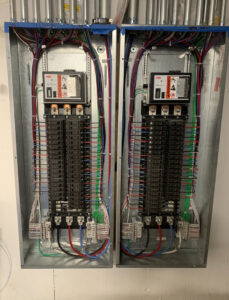 Neatly organized electrical breaker panels with detailed wiring, installed by TF Electrical Solutions in Omaha, NE.