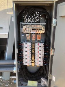 Neatly organized wiring and components inside an electrical panel by All American Pro Electric LLC in Cedar Creek, TX.