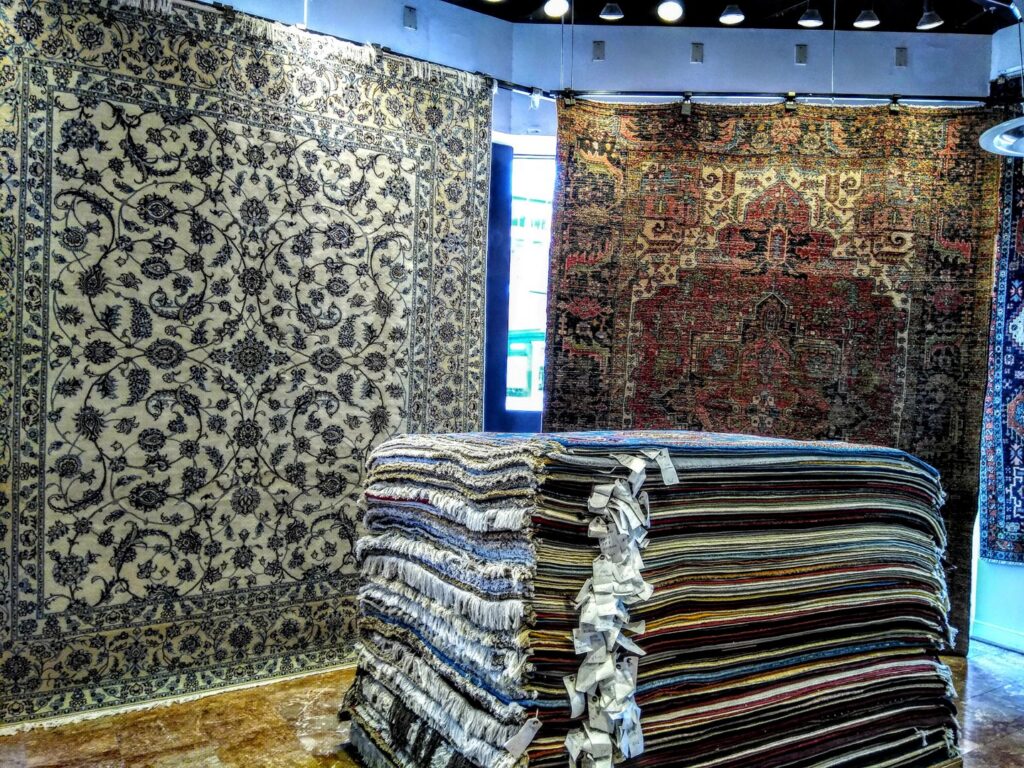 A wide selection of oriental rugs displayed in the gallery of J and J Oriental Rug Gallery in Alexandria, VA.