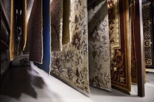 Various oriental rugs hanging to dry in a professional cleaning facility at Alexandria Green Carpet & Rug Cleaning in Alexandria, VA.