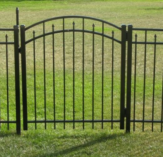 A stylish black ornamental metal fence gate installed by America's Fencing in Nashville, TN.