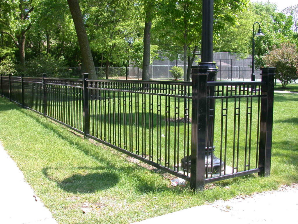 A black ornamental metal fence installed in a park setting by Superior Custom Fence Inc. in Chicago, IL.