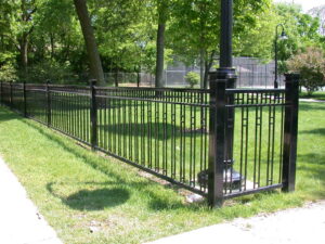 A black ornamental metal fence installed in a park setting by Superior Custom Fence Inc. in Chicago, IL.