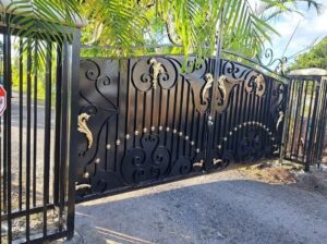 An ornate black and gold wrought iron gate providing elegant security by A Master Work Corp. in Hialeah, FL.