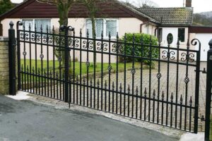 An ornate black wrought iron gate and matching fence installed by Fence Company Chicago in Chicago, IL
