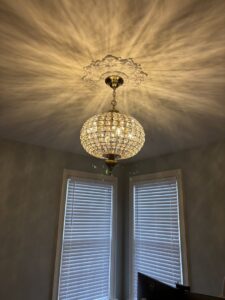 An elegant, ornate chandelier expertly installed by Abe Electric LLC, enhancing a room in Wallingford, CT.